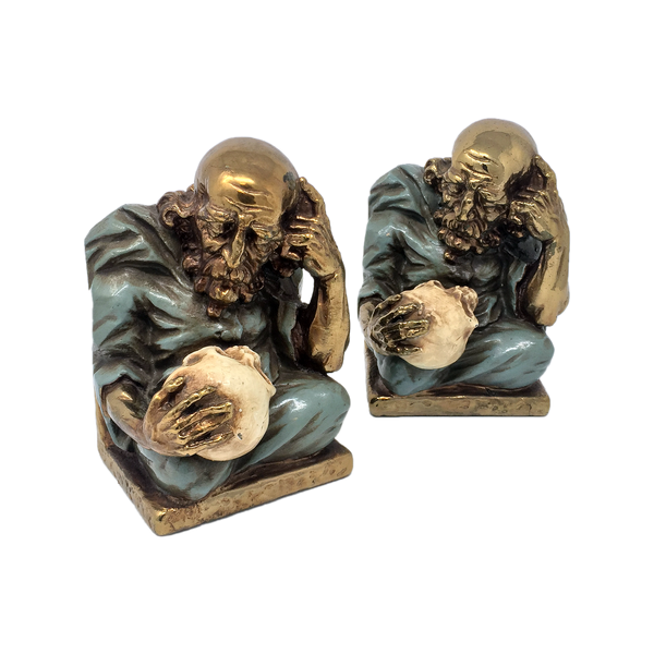 Antique bronze-clad alchemist with skull bookends by Marion Bronze circa 1922