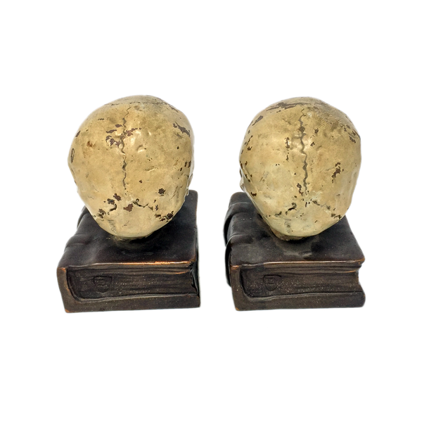 Antique bronze-clad skull and grimoire bookends by Armor Bronze circa 1922